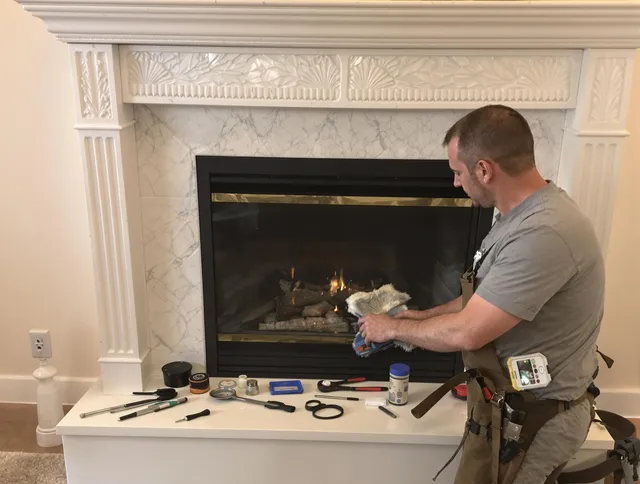 Darien Chimney Sweep performing fireplace maintenance in Darien, CT