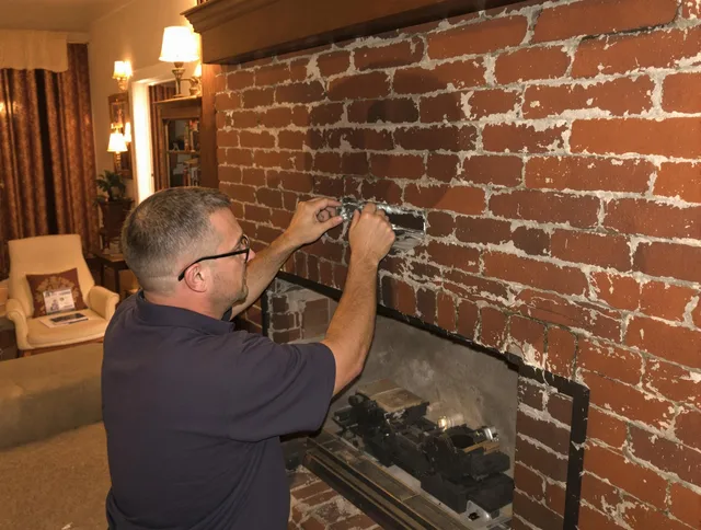 Darien Chimney Sweep expert fixing a fireplace in Darien, CT